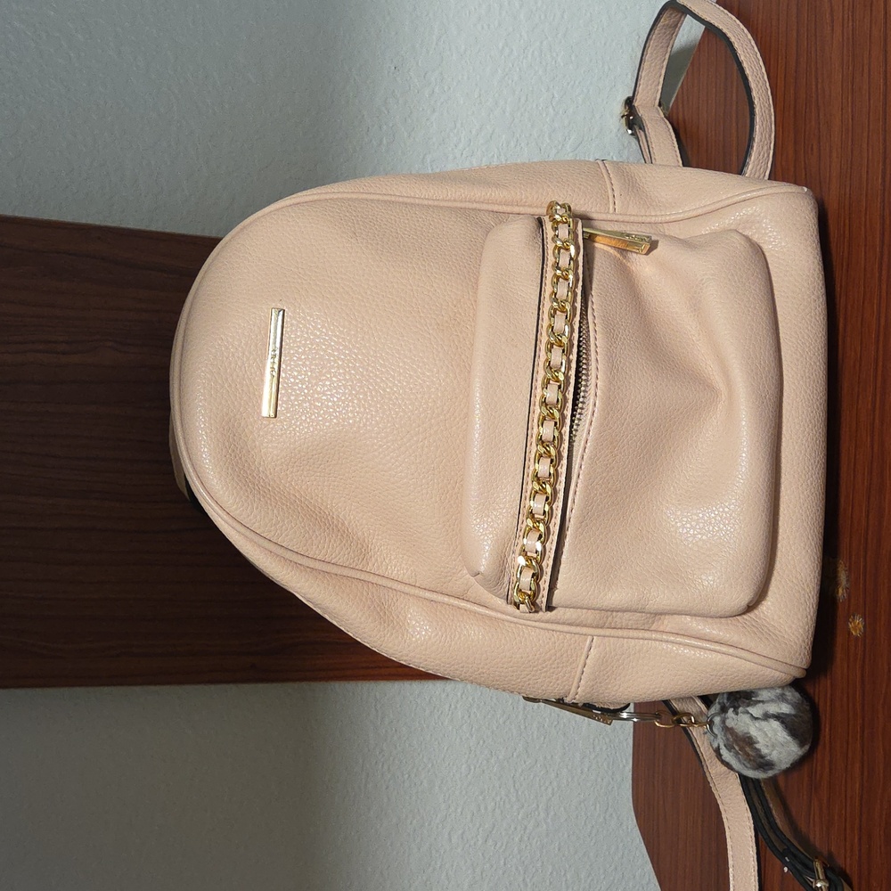 Elegant Light Pink Backpack with Gold Accents